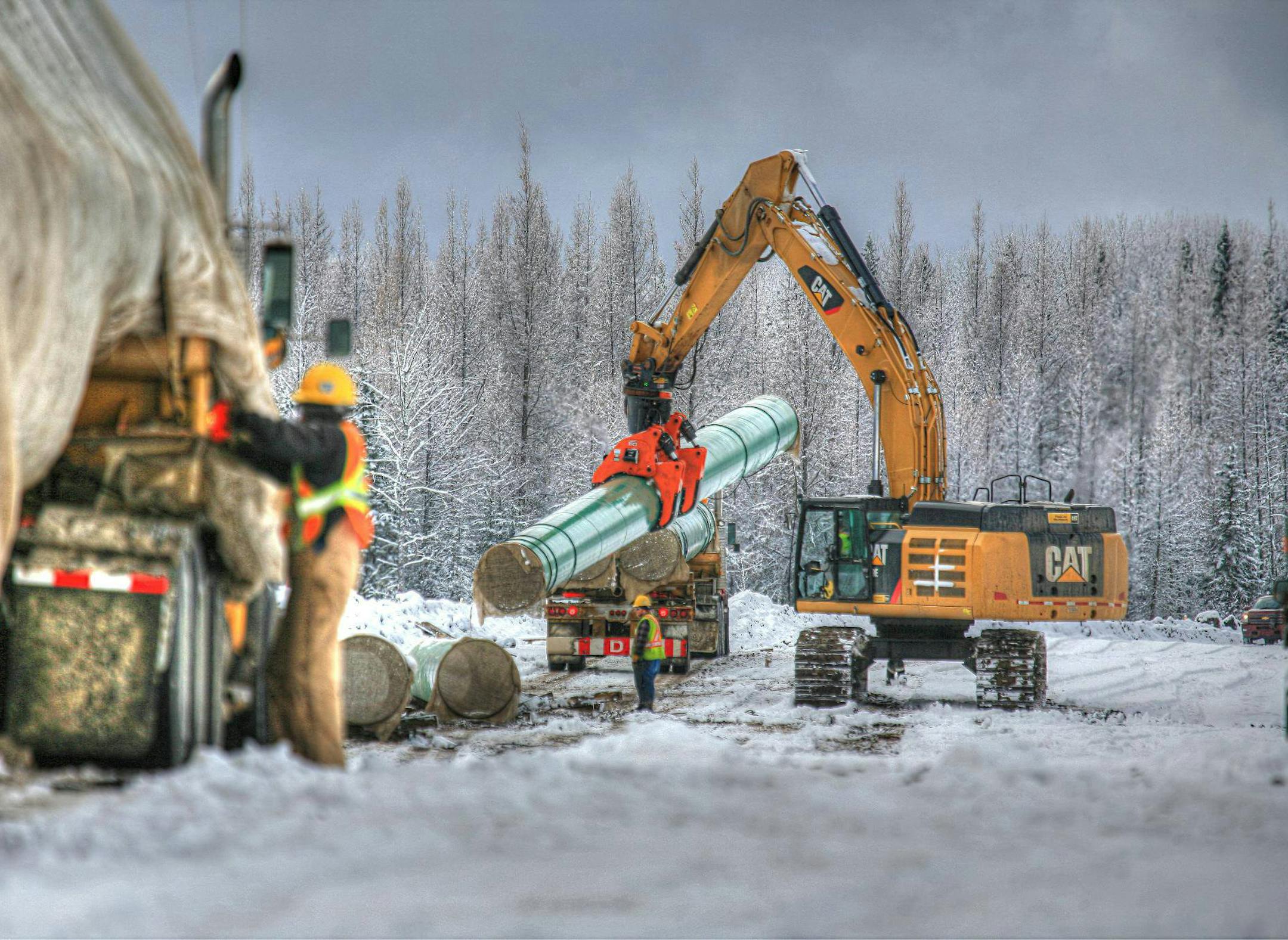 &#x201a;&#xc4;&#xfa;The DECKHAND backhoe attachment, made in Bemidji, Minn., moving pipe in 2013.&#x201a;&#xc4;&#xf9; Credit: Courtesy LaValley Industries