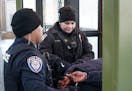 Metro Transit cops Tommy Eam and Erika Hatle detained a Green Line rider who had been acting erratically Tuesday.