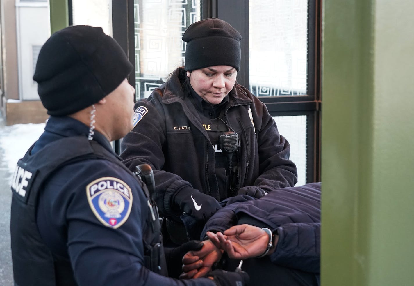 Metro Transit cops Tommy Eam and Erika Hatle detained a Green Line rider who had been acting erratically Tuesday.