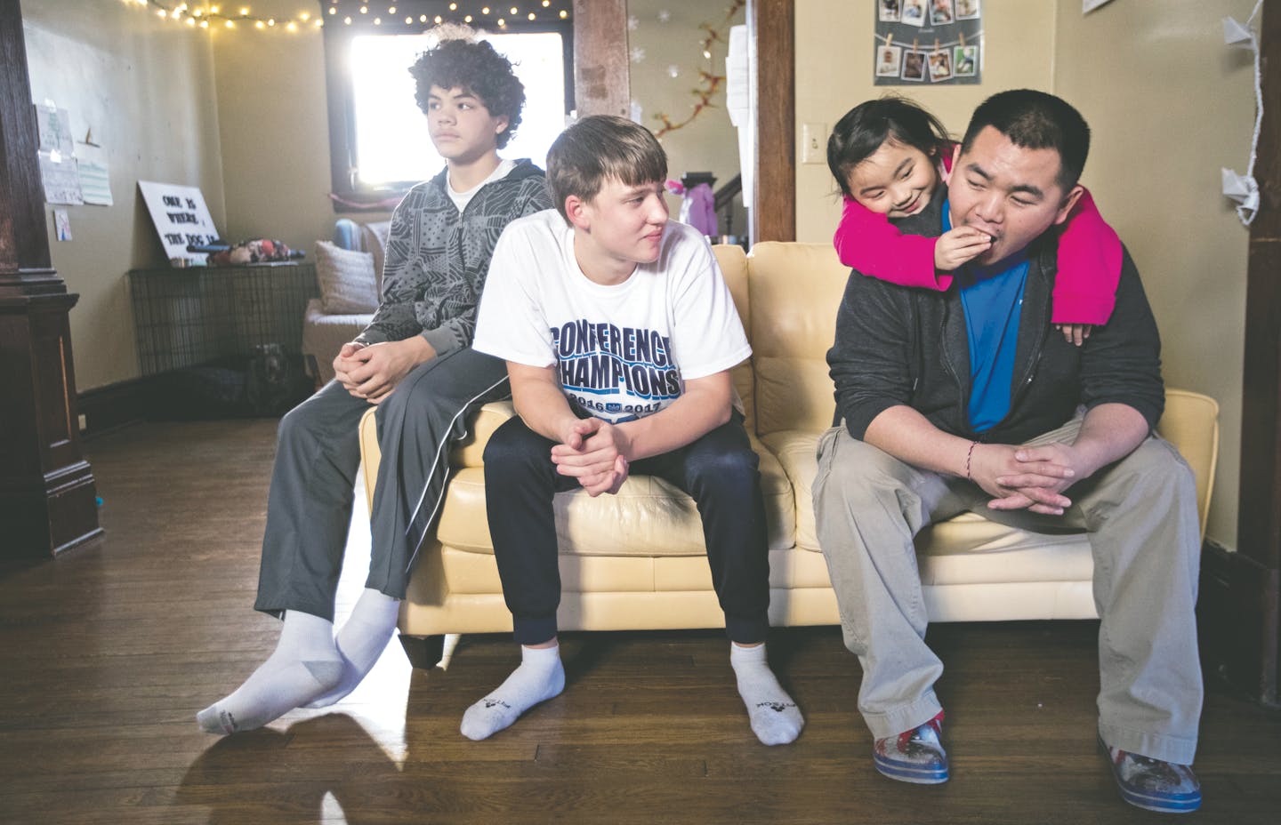 Minnehaha Academy students Daniel Rose, from left, 14, and Peter Shaffer, 14, hang out with Ken Vue and his daughter Diav Vue, 7, while staying at their home in St. Paul. ] LEILA NAVIDI &#xef; leila.navidi@startribune.com BACKGROUND INFORMATION: in St Paul on Wednesday, March 15, 2017. City Stay is an opportunity for Minnesota high school students to do home stays at the homes of other local residents. The cultural exchange program fosters new relationships among Minnesota's European, Latin Amer