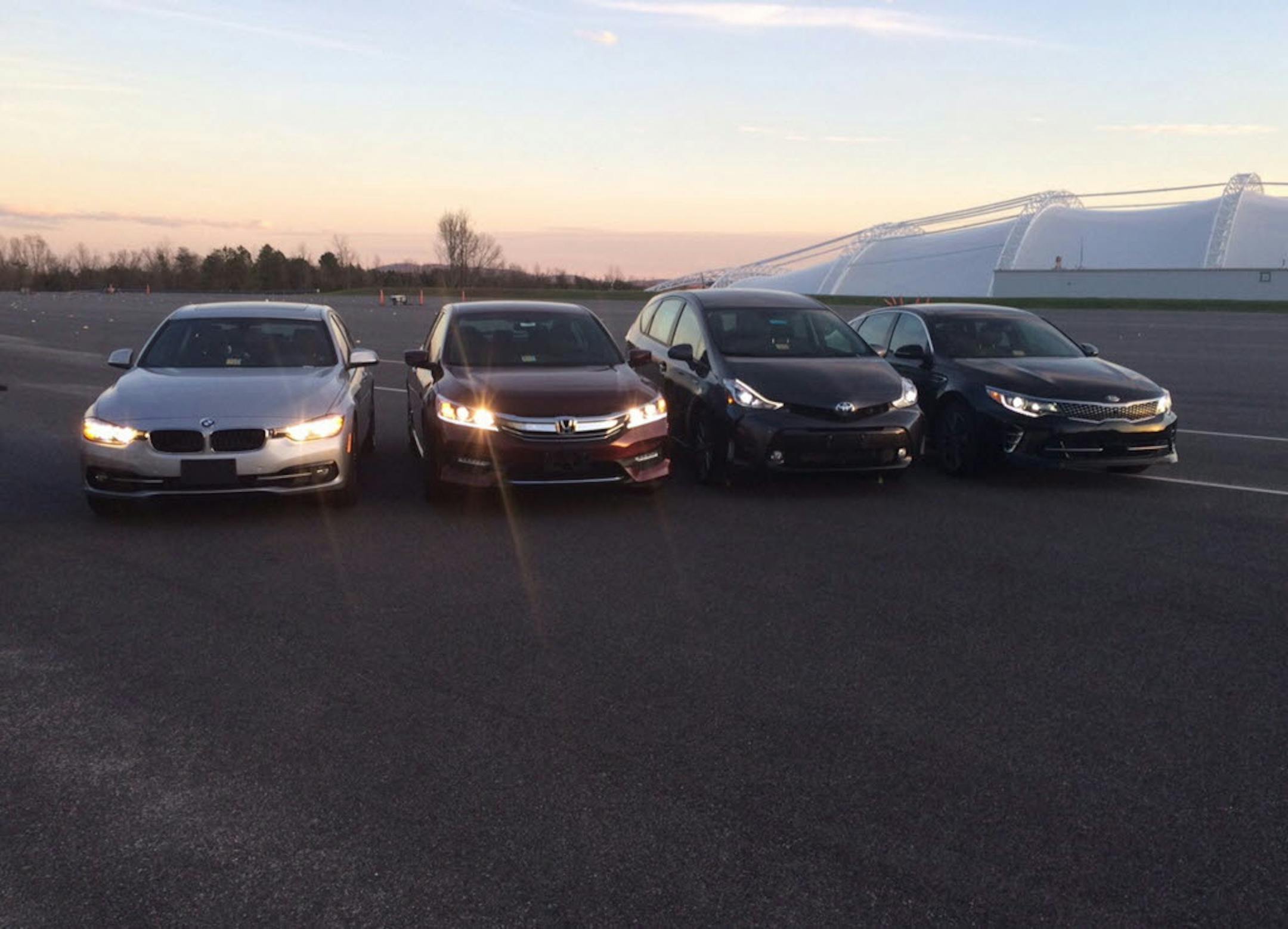 From left: A BMW 3 series, Honda Accord, Toyota Prius V and a Kia Optima are seen at the Vehicle Research Center in Ruckersville, Va., as part of a headlight study.