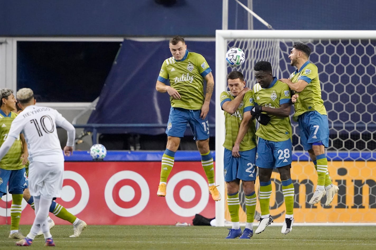 Minnesota United's Emanuel Reynoso (10) snaked a free kick past Seattle's Jordan Morris (13), Shane O'Neill (27), Yeimar Gomez Andrade (28) and Cristian Roldan (7) for a goal during the first half of the Western Conference final Monday.