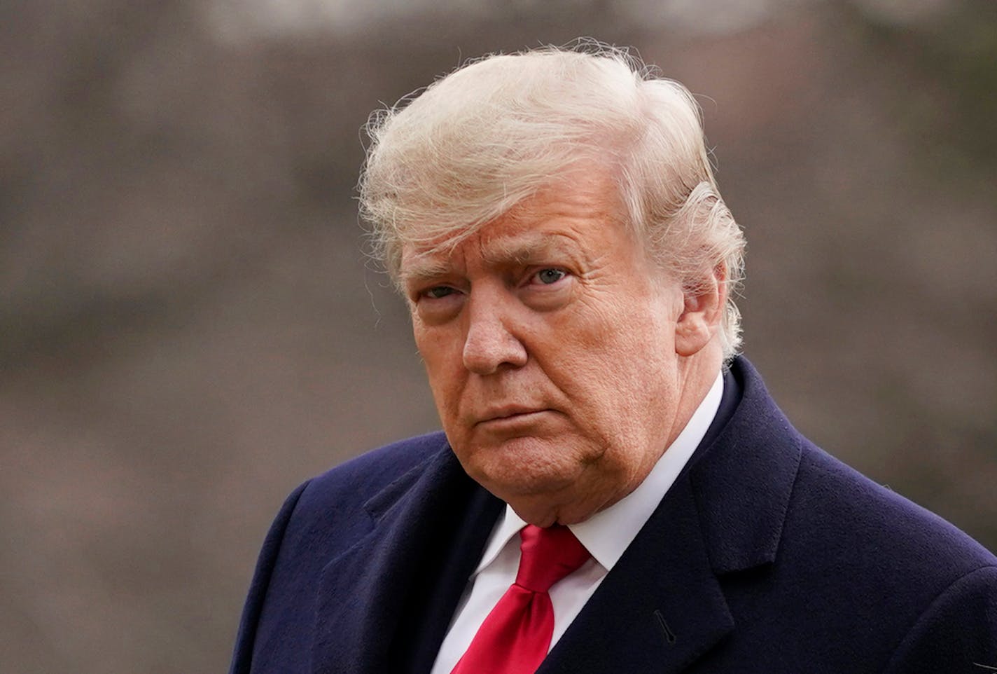 FILE - In this Dec. 31, 2020, file photo, President Donald Trump arrives on the South Lawn of the White House, in Washington. Facebook says, on Friday, June 4, it will suspend Trump's accounts for two years following its finding that he stoked violence ahead of the deadly Jan. 6 insurrection. Facebook also plans to end a contentious policy championed by CEO Mark Zuckerberg that automatically exempted politicians from certain moderation rules on its site. (AP Photo/Evan Vucci, File)