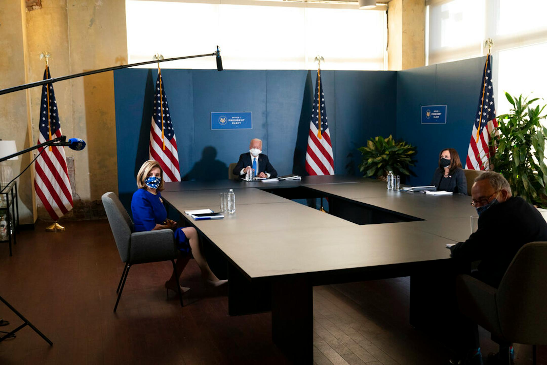 President-elect Joe Biden, speaks during a meeting with Vice President-elect Kamala Harris, right, Senate Minority Leader Chuck Schumer of N.Y., and House Speaker Nancy Pelosi of Calif., left, Friday, Nov. 20, 2020, in Wilmington, Del. (AP Photo/Alex Brandon)