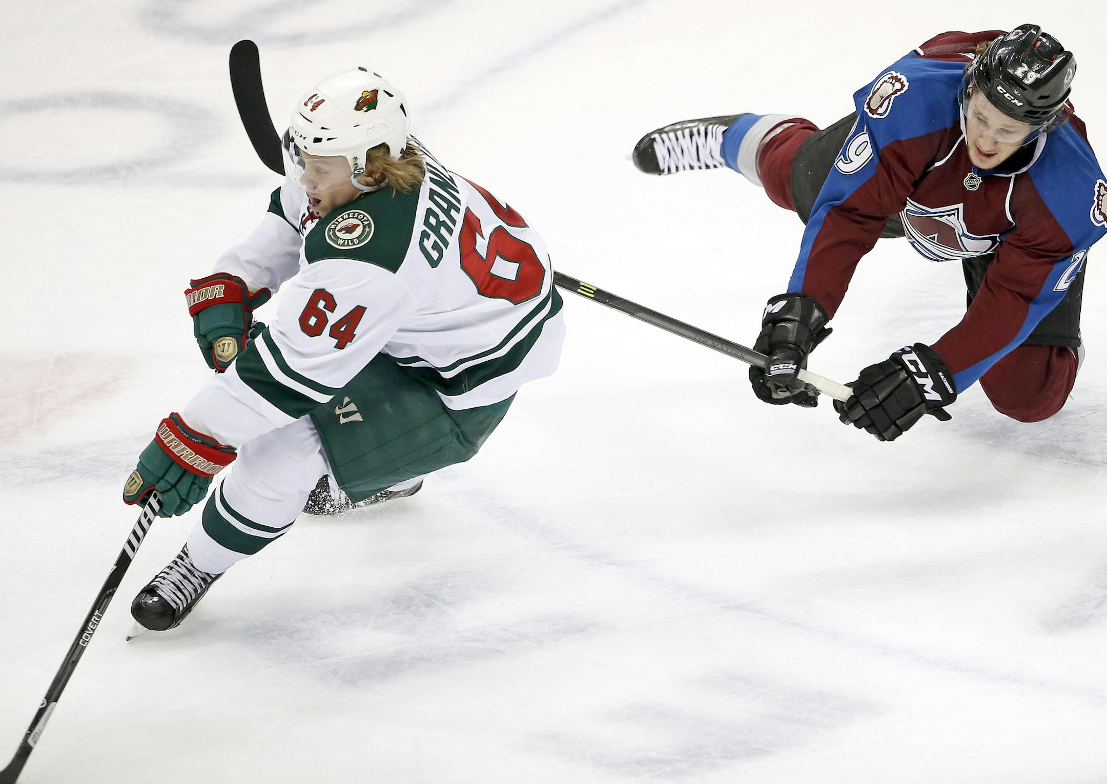 The Minnesota Wild's Mikael Granlund skates away from the Colorado Avalanche's Nathan MacKinnon during the first period of play Wednesday during game 7 of the first round of the Stanley Cup Playoffs, Wednesday at the Pepsi Center in Denver, Colorado. ] CARLOS GONZALEZ cgonzalez@startribune.com - April 30, 2014, Denver, Colorado, Pepsi Center, NHL, Minnesota Wild vs. Colorado Avalanche, Stanley Cup Playoffs round 1, Game 7