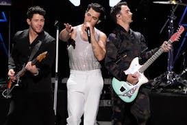 Nick Jonas, left, Joe Jonas and Kevin Jonas perform at Z100’s iHeartRadio Jingle Bal in New York on Dec. 10, 2021. 