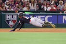 Minnesota Twins designated hitter Byron Buxton (25) slid safely into third base on a single by Kyle Farmer during the fourth inning of a baseball game