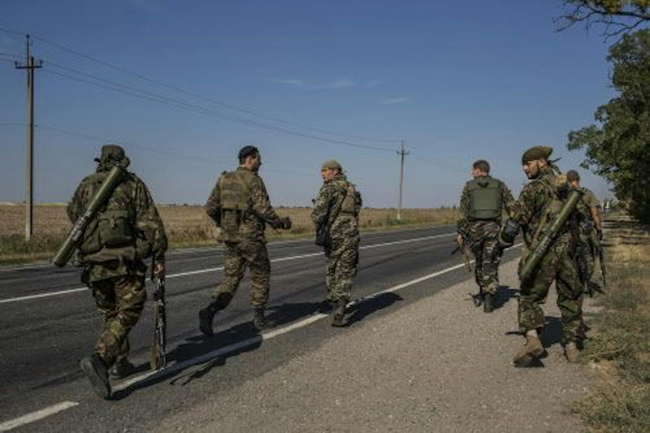 Ukrainian soldiers regroup after coming under heavy attack in Novoazovsk, Ukraine, a town near the Russian border, Aug. 26, 2014.