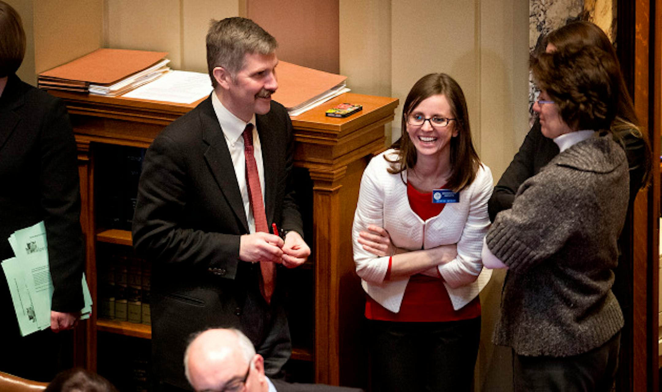 Bill author Sen. Tony Lourey laughed with staffers including Stacie Weeks, center after the final vote. The Minnesota Senate passed the health insurance exchange bill by a straight party line vote 39-28.  Next stop is Governor Dayton's desk.   Monday, March 18, 2013.    ]   GLEN STUBBE * gstubbe@startribune.com