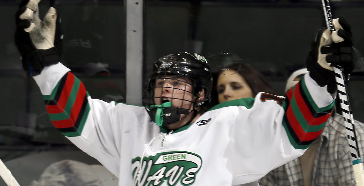 Kolton Aubol (14) of East Grand Forks celebrated after scoring his first of two goals in the first period. ] CARLOS GONZALEZ cgonzalez@startribune.com - March 6, 2013, St. Paul, Minn., Xcel Energy Center, Minnesota High School Boys State Hockey, East Grand Forks vs. Rochester Lourdes/Stewartville