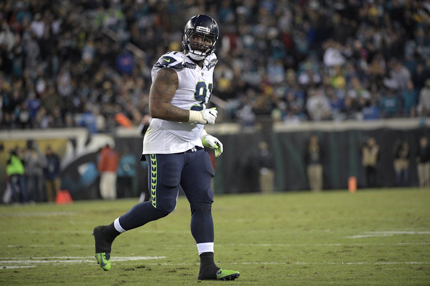 Sheldon Richardson jogs off the field after a play during the second half of an NFL football game last season.