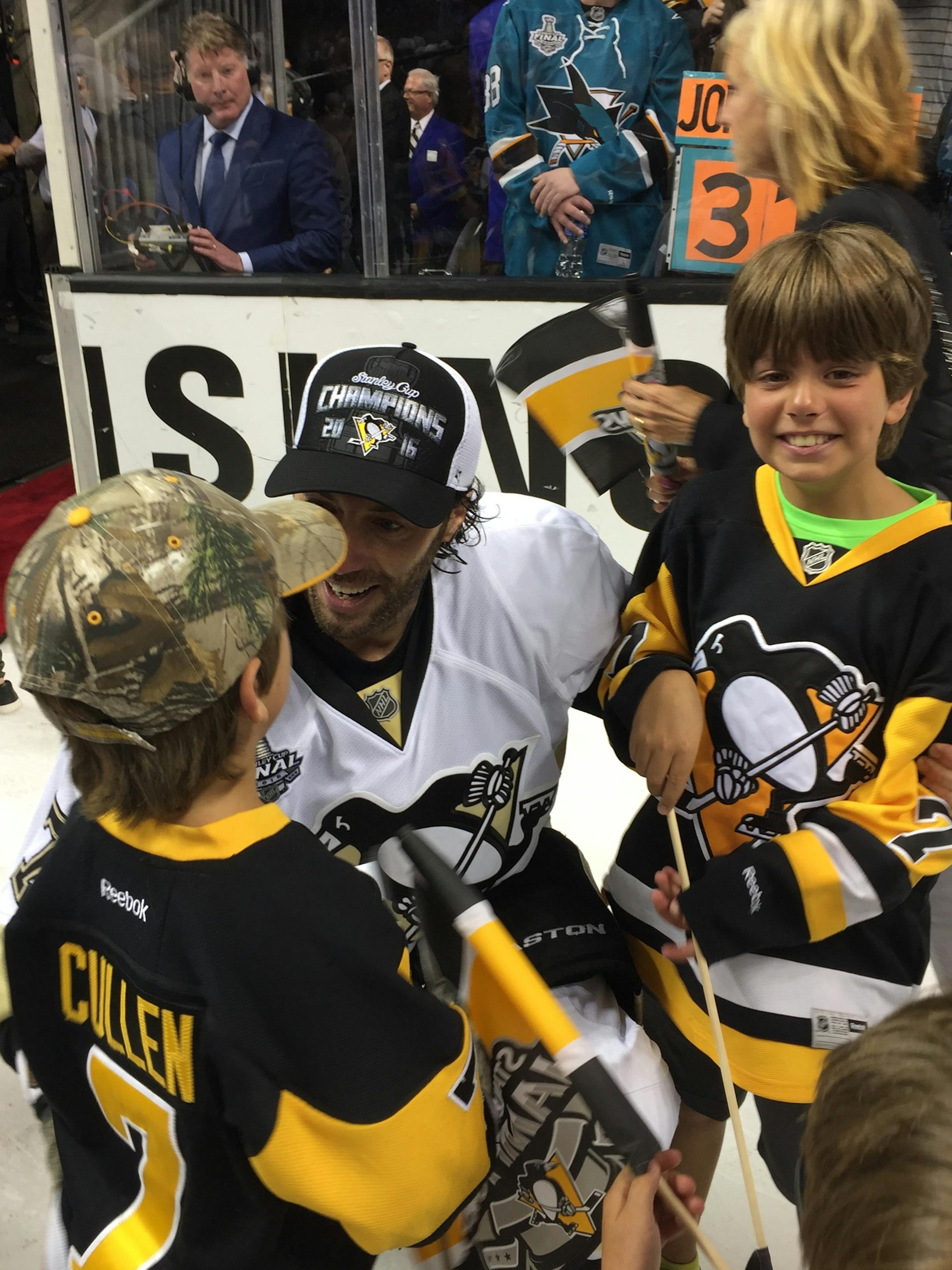 Matt Cullen and two of his sons celebrate the Stanley Cup victory.