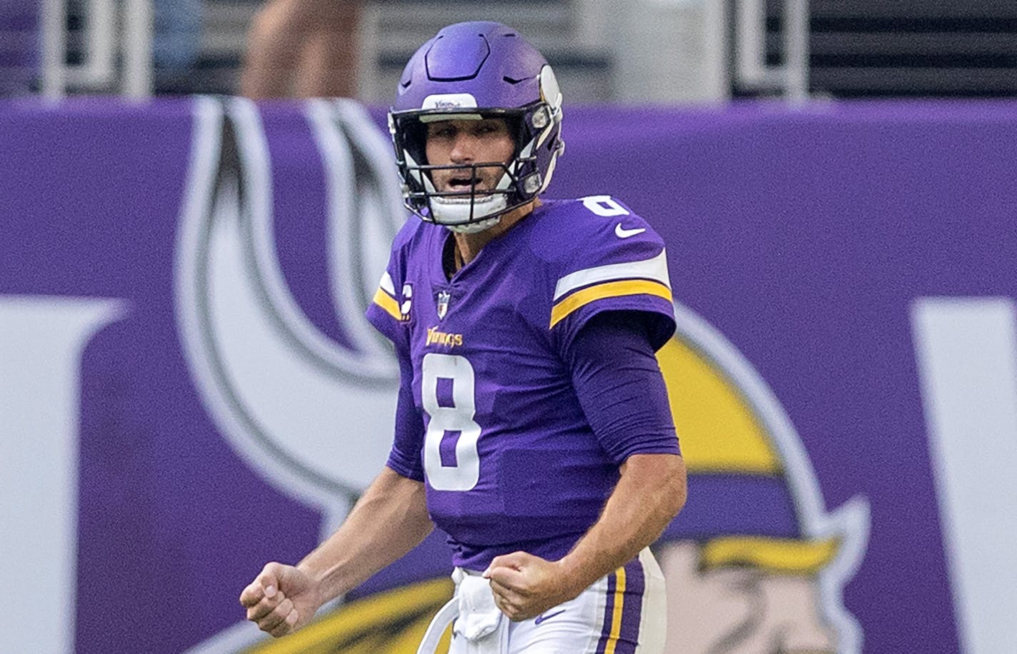 Minnesota Vikings quarterback Kirk Cousins (8) celebrated after throwing a touchdown to Adam Thielen in the second quarter.