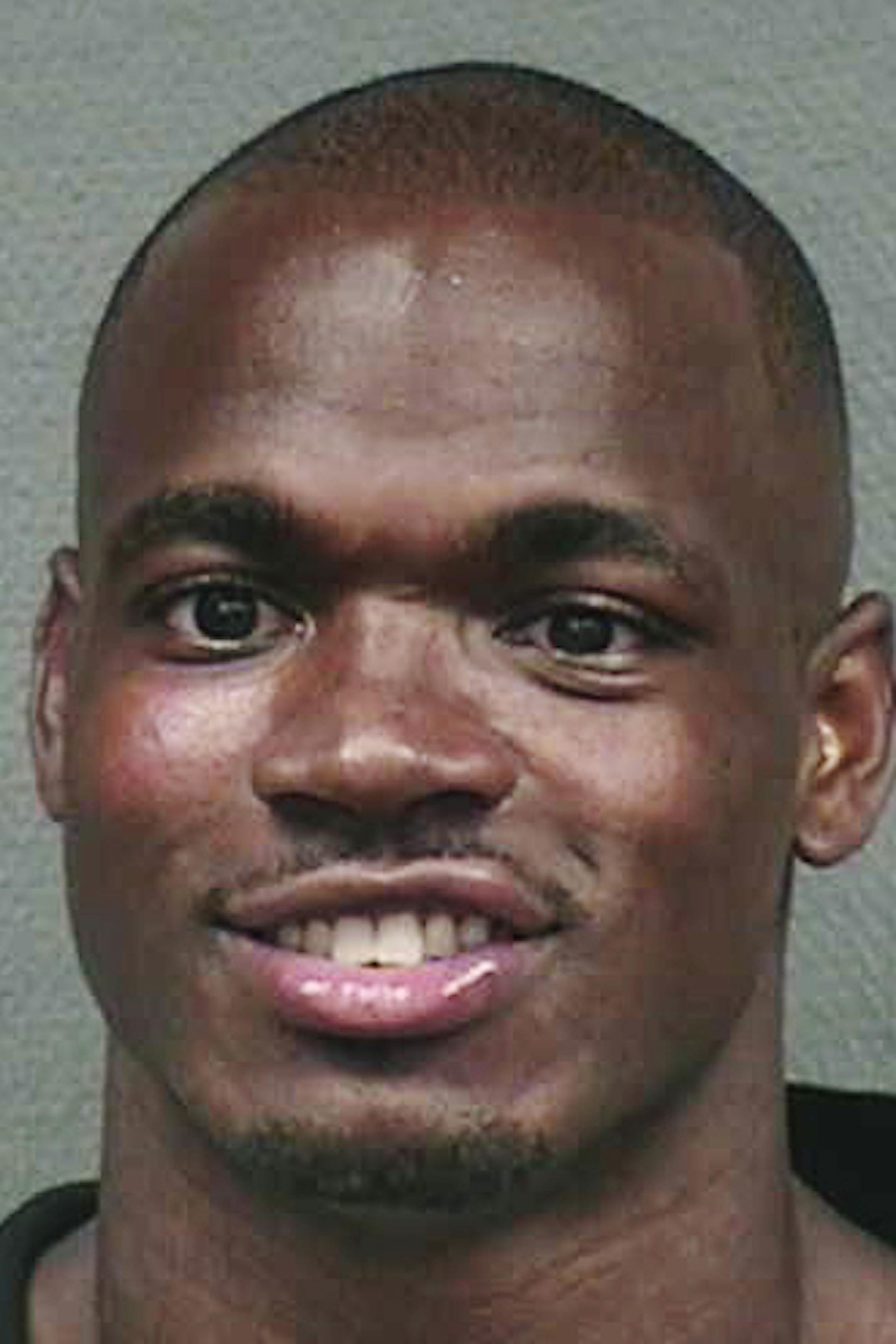 This undated photo provided by the Houston Police Department shows Minnesota Vikings running back Adrian Peterson. Peterson was arrested and charged with resisting arrest after allegedly pushing an off-duty police officer who was working security at a night club, Saturday, July 7, 2012, in Houston. Peterson has since hired Rusty Hardin, the attorney who represented Roger Clemens in his recent perjury case, to help him. (AP Photo/Houston Police Department) ORG XMIT: MIN2013031616571728