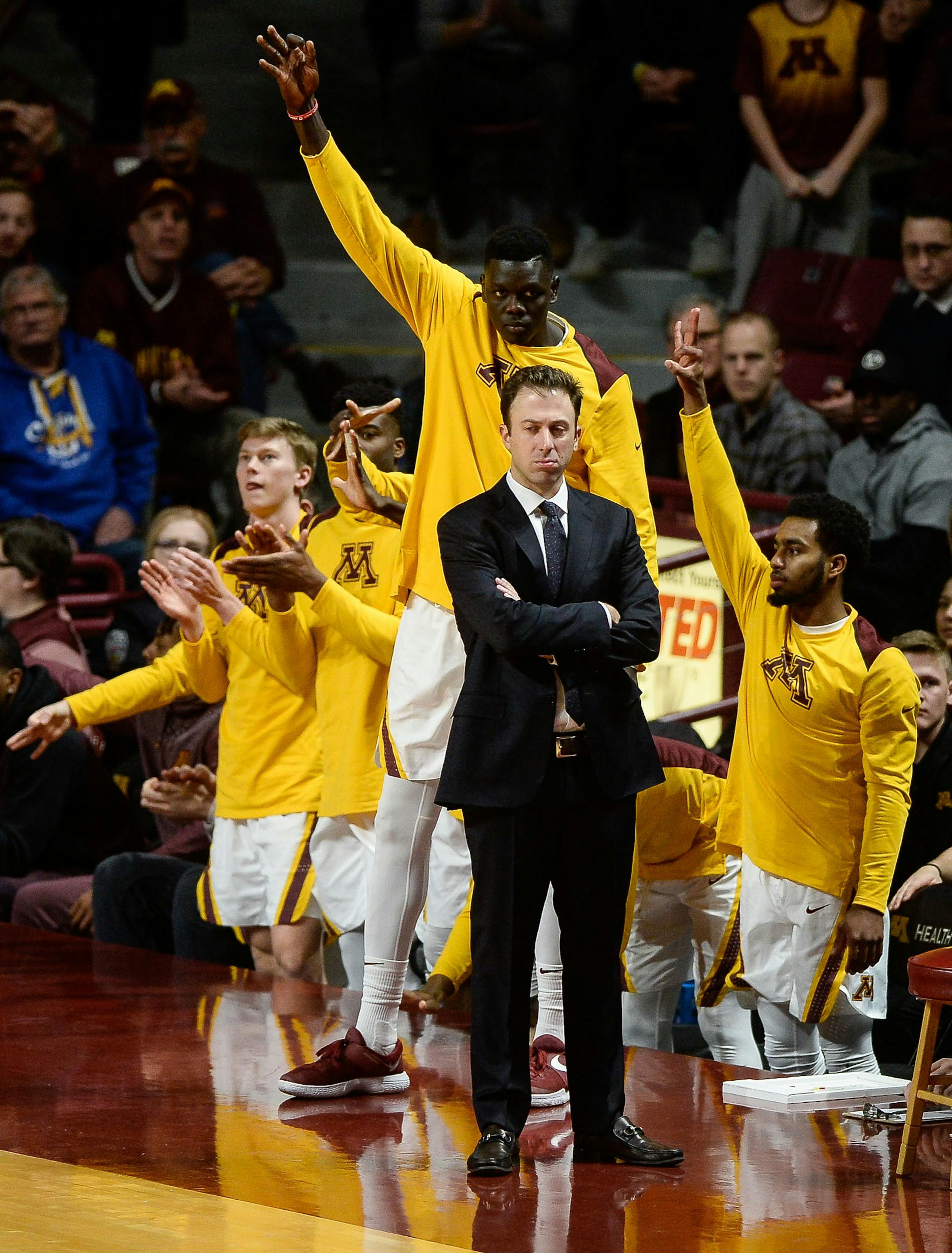 Minnesota Gophers head coach Richard Pitino looked on as the bench erupted following an early 3-pointer by guard Nate Mason in the first half against the Florida Atlantic on December 23, 2017.