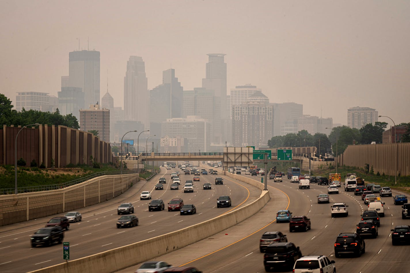 A smoky haze enveloped Minneapolis seen from the south across I-35W Wednesday, June 14, 2023 Minneapolis, Minn. Smoke from Canadian wildfires blowing into Minnesota is making for a bad air day. The MPCA has issued an air quality alert covering the northern half of the state, the metro area and a portion of southern Minnesota.