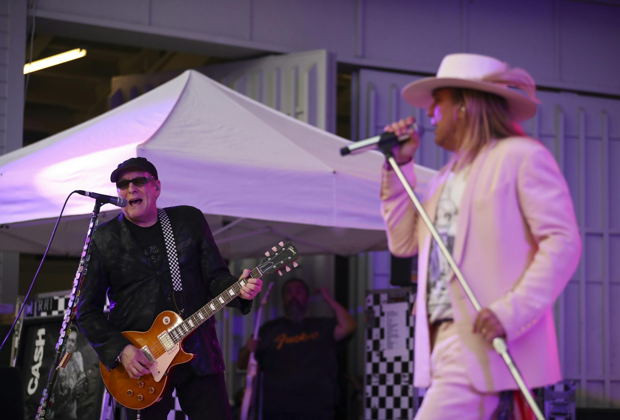 Cheap Trick's guitarist Rick Nielsen, left, with lead singer Robin Zander early in their set Thursday night.
