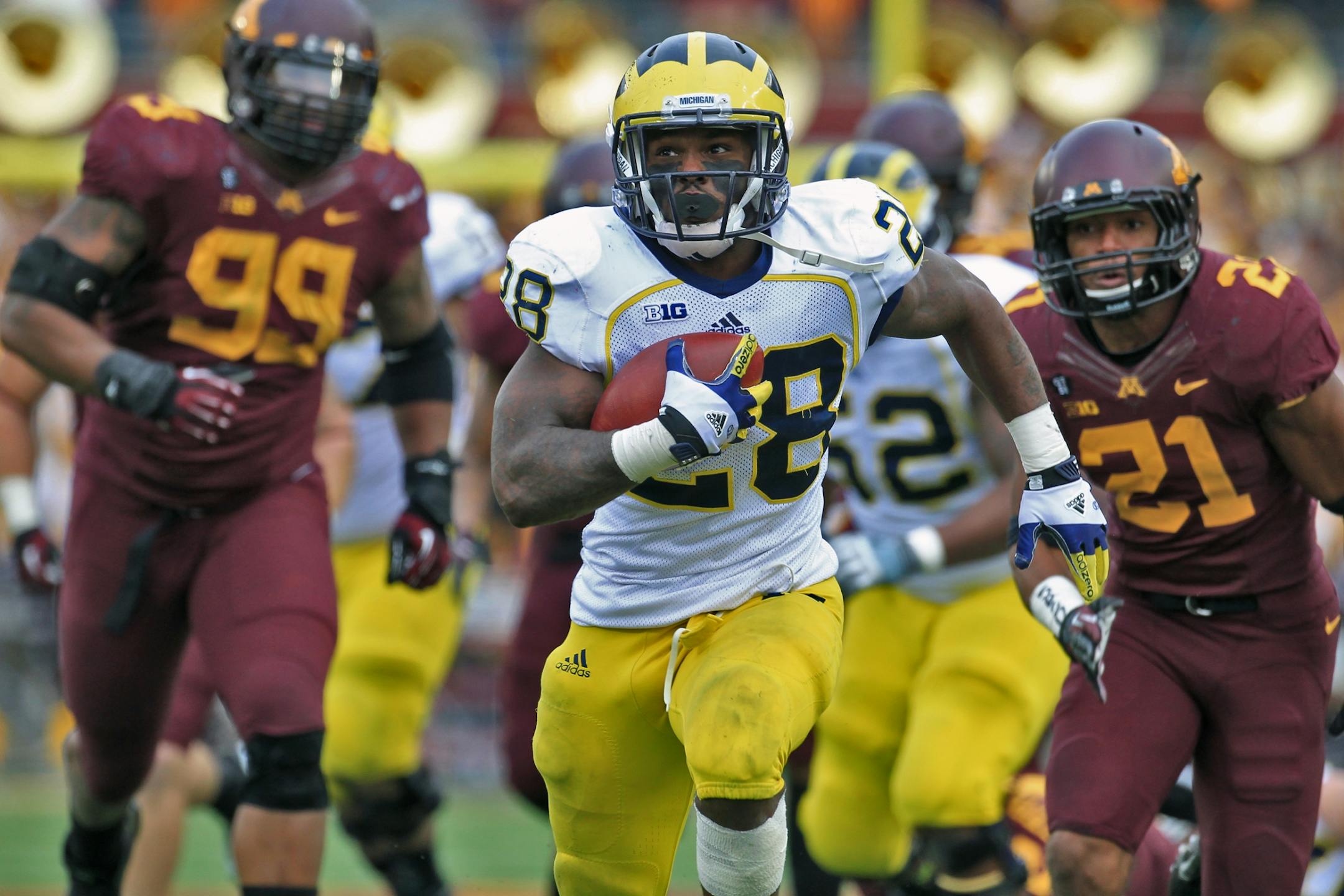 Michigan running backl Fitzgerald Toussaint ran for a touchdown against the Gophers in 2012. Michigan won 35-13.