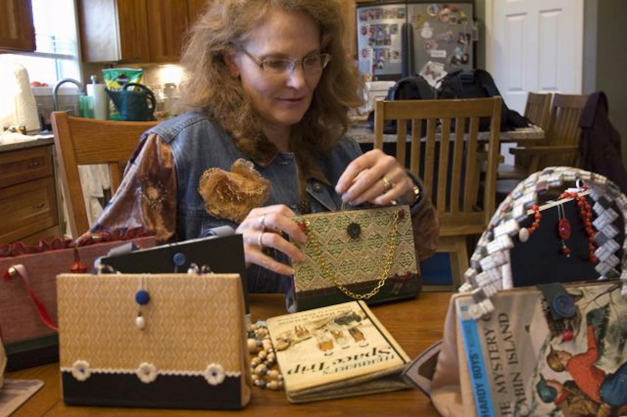 Photos by Liz Rolfsmeier Leslie Mullin of Lakevile makes purses out of recycled books. She says her chalkboard purses are a popular gift for teachers.
