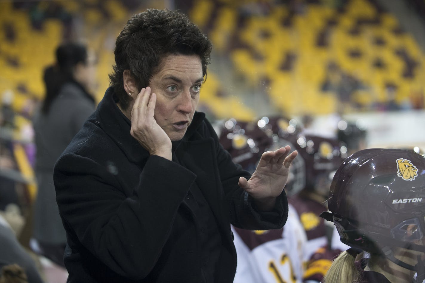 University of Minnesota Duluth head coach Shannon Miller shows intensity while instructing forward Demi Crossman during the first period of Saturday night's game.