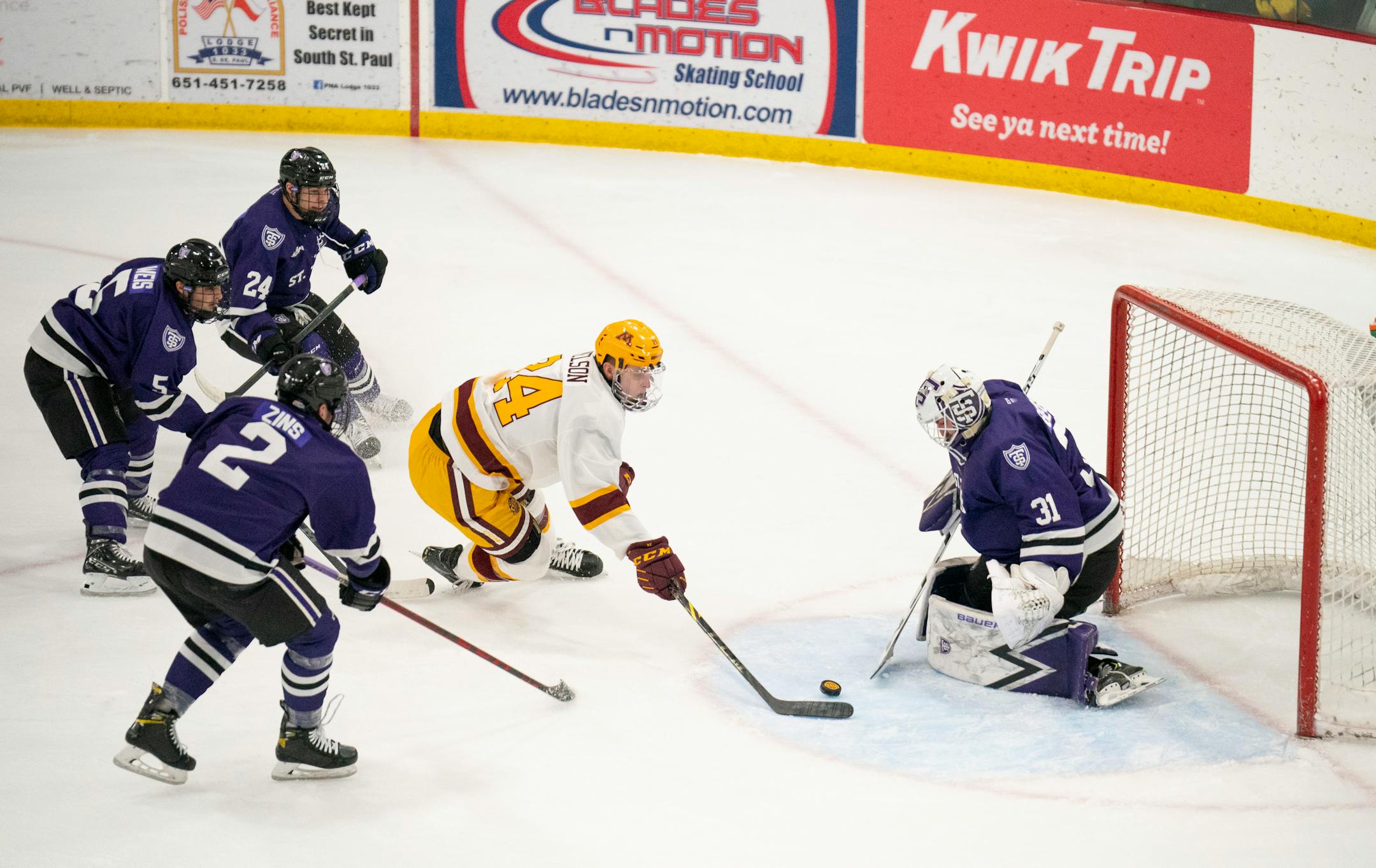 Tommies goaltender Jacob Berger (31) stopped a first period shot by Gophers forward Jaxon Nelson (24) Sunday afternoon, Jan. 2, 2022 at Doug Woog Arena in South St. Paul.