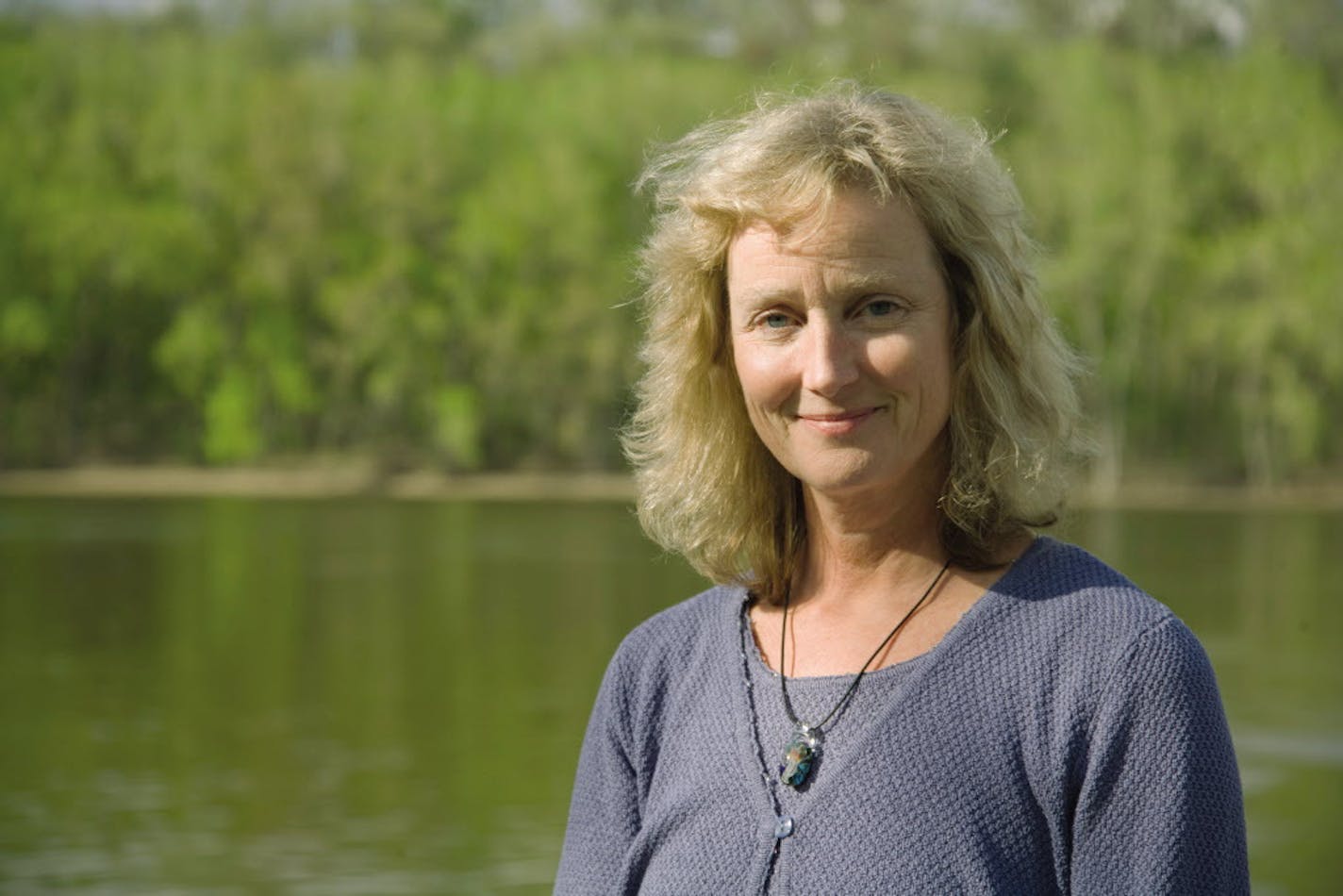 Deborah Swackhamer, director of U of MN Water Resources Center, posing along Mississippi River. Budget ID NO. 1003784397
Credit: University of Minnesota.