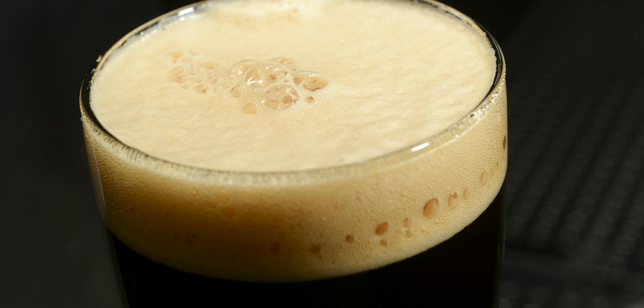 In this Dec. 30, 2013 photo, the light brown head on a glass of India Brown Ale is seen at Hopvine Brewing Co. in Aurora, Ill. (AP Photo/Daily Herald, Mark Black) ORG XMIT: MIN2014031313370051