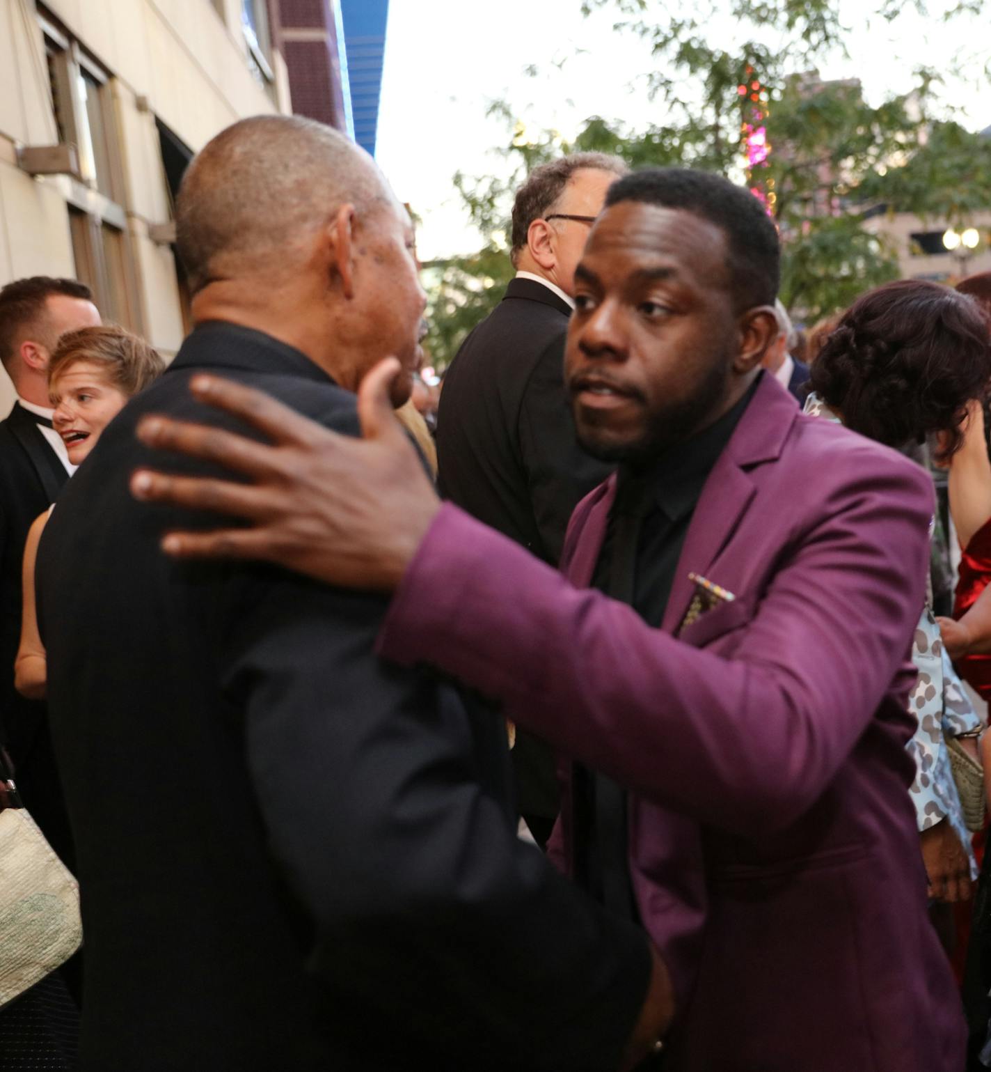 Mikell Sapp, (in purple suit) greets actor James Craven (black suit) arriving at the Ivey Awards monday in Minneapolis. The Twin Cities celebrated the 2015 Ivey Awards, Monday September 21, 2015 at the State Theater in Downtown Minneapolis. The awards were established in 2004 and are unique among awards events in the country in that they are open to the public and that there are no nominees, set number of awards or pre-determined award categories, with the exception of the Lifetime Achievement a