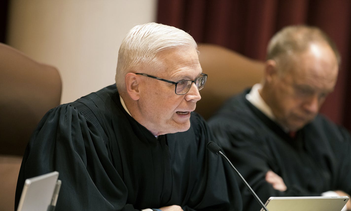 FILE - In this Aug. 28, 2017 file photo, Minnesota Supreme Court Associate Justice David L. Lillehaug asks questions during oral arguments at the Capitol in St. Paul, Minn. Lillehaug says he has Parkinson's disease and won't seek re-election next year. Lillehaug says in a statement via the court that he expects to resign in July 2020. (Leila Navidi/Star Tribune via AP, File)