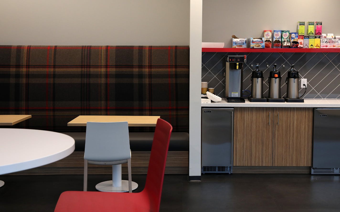 Coffee makers and plaid adorn an employee break area at Kraus Anderson. ] ANTHONY SOUFFLE &#xef; anthony.souffle@startribune.com Al Gerhardt, the recently promoted president of Kraus Anderson Construction Company stood for a portrait and gave a tour of their new and improved headquarters building Friday, Oct. 27, 2017 in downtown Minneapolis. The building is part of an extensive project that will dramatically impact the East Town and Elliot Park neighborhoods with a new brewpub, 17-story apartme