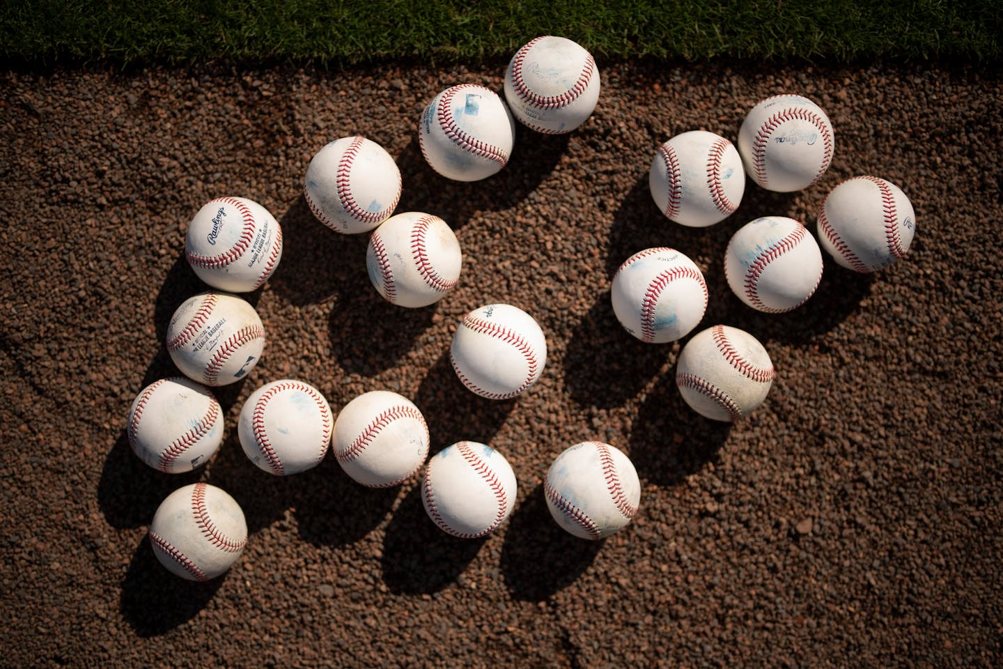 Practice balls in the infield gravel at Hammond Stadium in Fort Myers, Florida Friday, March 18, 2022. Minnesota Twins players not playing in a game against the Atlanta Braves continued working out at Hammond Stadium. ] JEFF WHEELER • Jeff.Wheeler@startribune.com