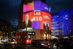 An exit poll predicting that the Labour Party led by Keir Starmer will win 410 seats in Britain's general election is projected onto BBC Broadcasting 