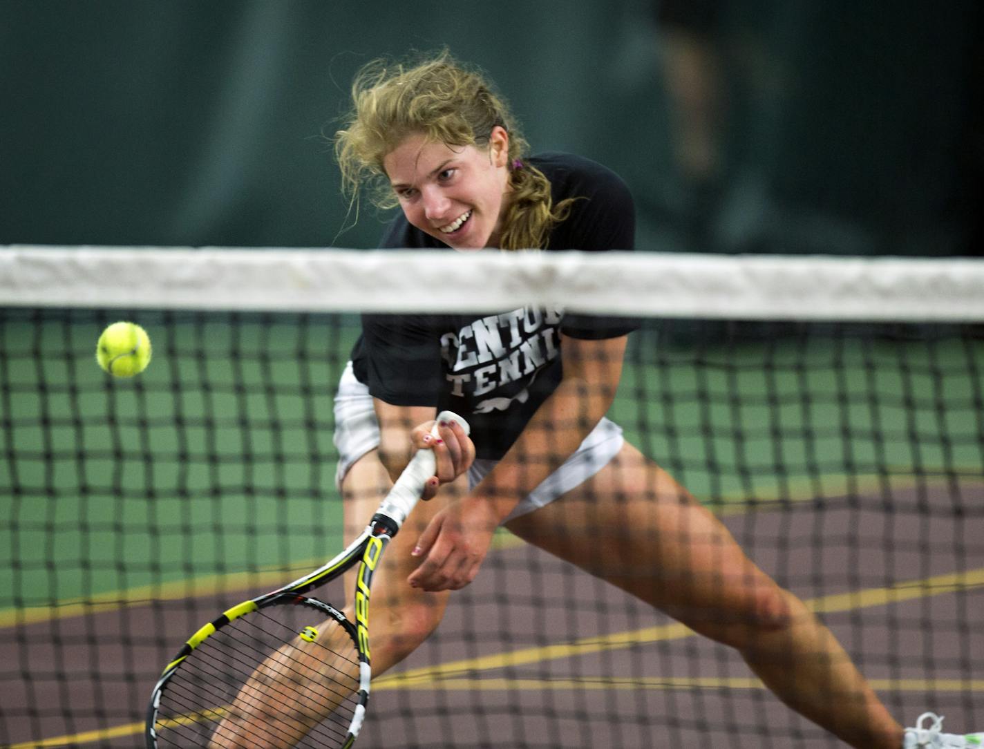 Rochester Century's Jessica Aney was a girls' champion in 2011 and 2012 before leaving the high school game. She came back to play with the boys this spring and today lost to Forest Lake's Toby Boyer, the second-ranked boys' player in the state. Here, Aney smiles after a great shot by Boyer dribbled over the net and she couldn't get to it despite a great effort.