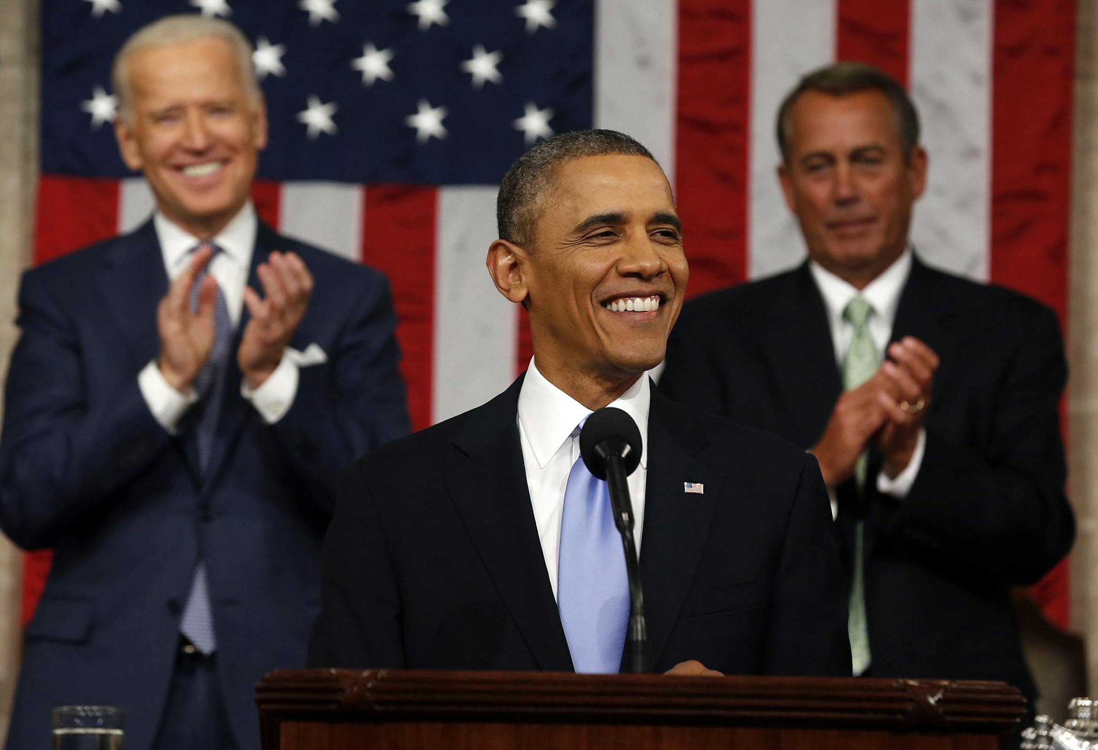President Barack Obama delivers the State of Union address before a joint session of Congress in the House chamber Tuesday, Jan. 28, 2014, in Washington, as Vice President Joe Biden, and House Speaker John Boehner of Ohio, applaud. (AP Photo/Larry Downing, Pool) ORG XMIT: MIN2014012822020638