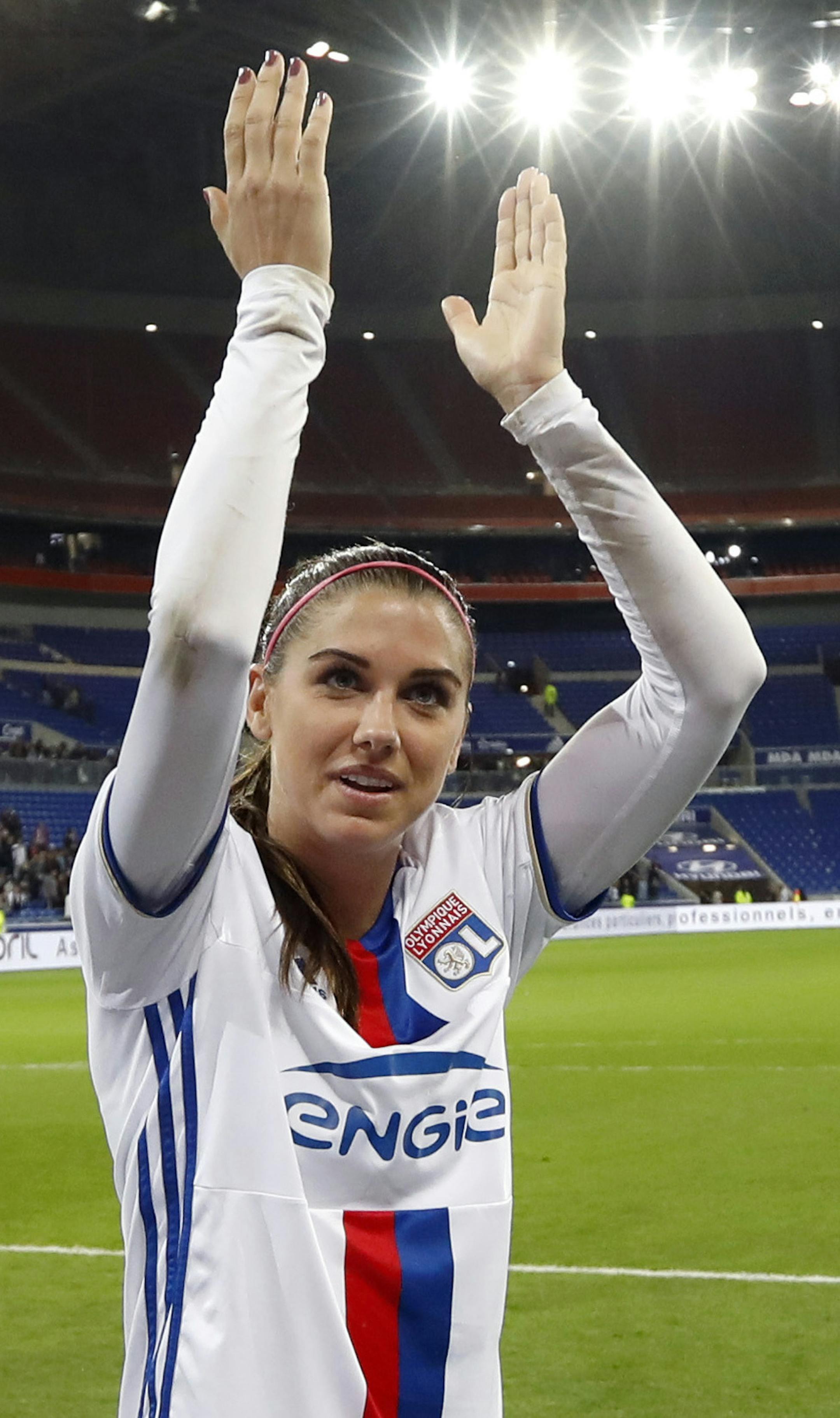 Lyon's Alex Morgan, right, celebrates with her teammates after they won their Women's Champions League semifinal soccer match against Manchester City in Decines, near Lyon, central France, Saturday, April 29, 2017. (AP Photo/Laurent Cipriani) ORG XMIT: MIN2017050520214943