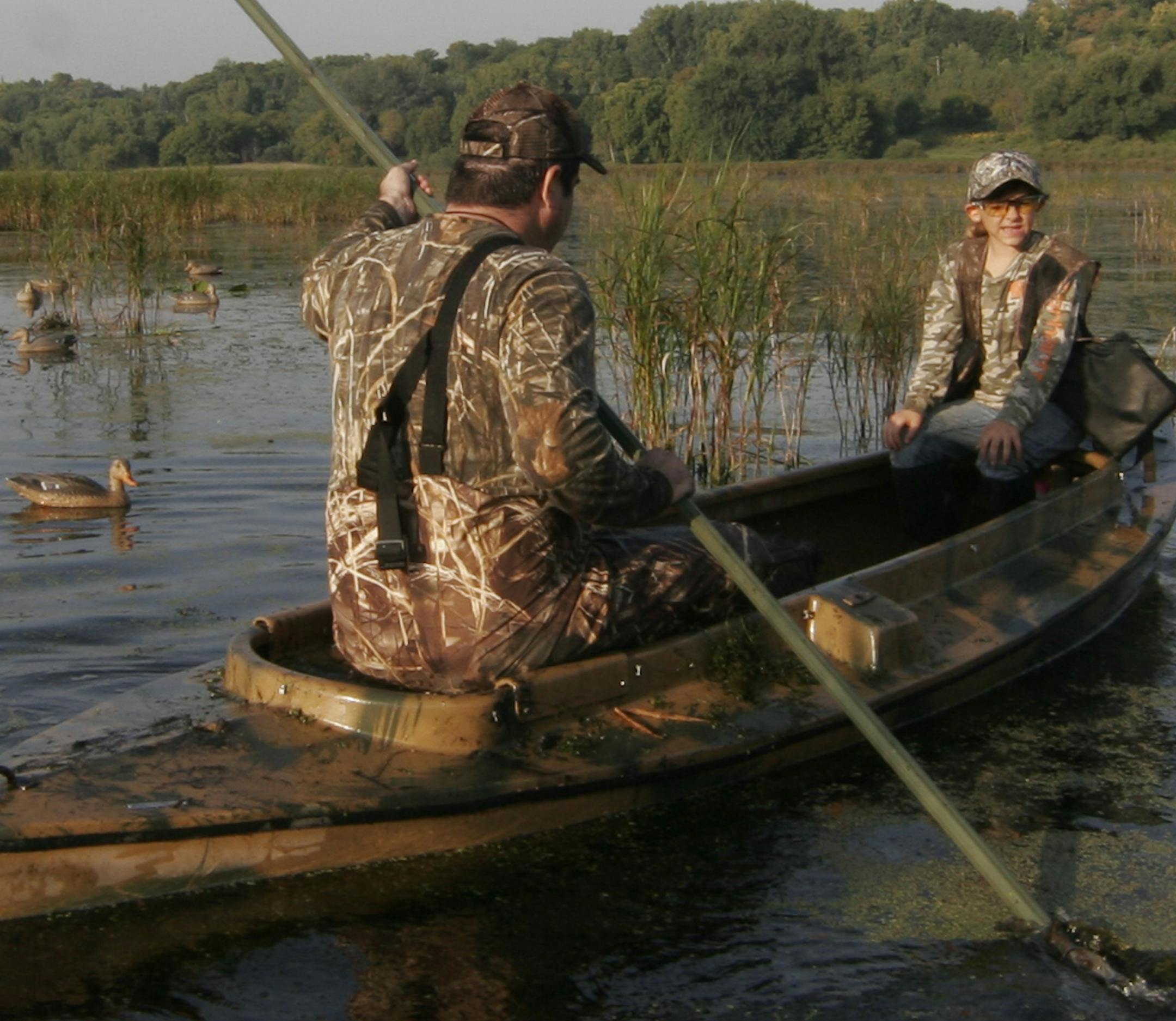 Doug Smith/Star Tribune; Sept. 7, 2013; Grace Rodemann, 11, of Carver on her first-ever waterfowl hunt Saturday on Carver Marsh. Mentor John Wartman, 47, of Waconia went to pick up decoys after calling it a morning.Grace was among the estimated 5,000 youths 15 and under participating in Youth Waterfowl Day.