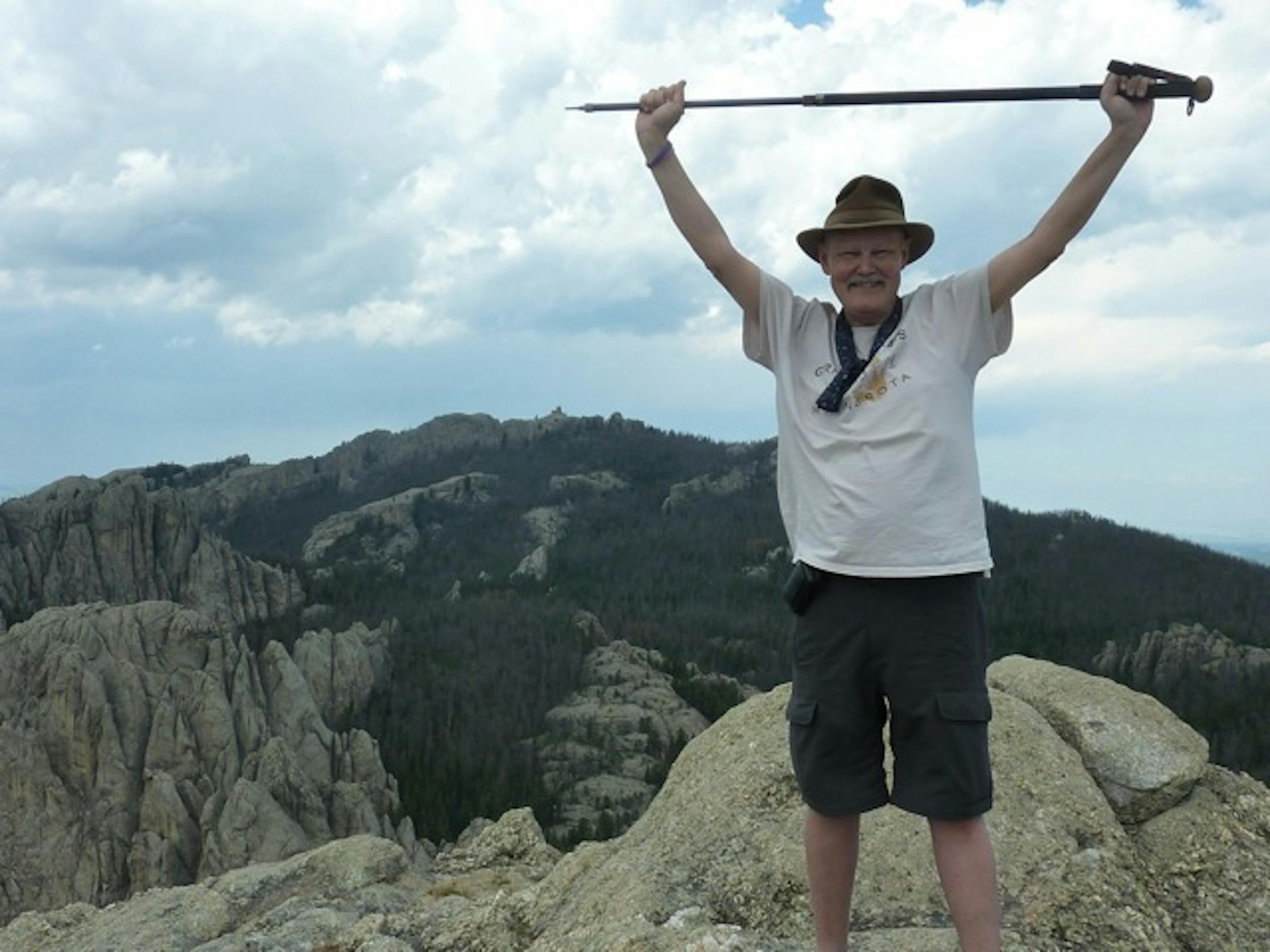 Dr. Judson Reaney celebrated after climbing Little Devils Tower in South Dakota recently, despite the fact he was dying.