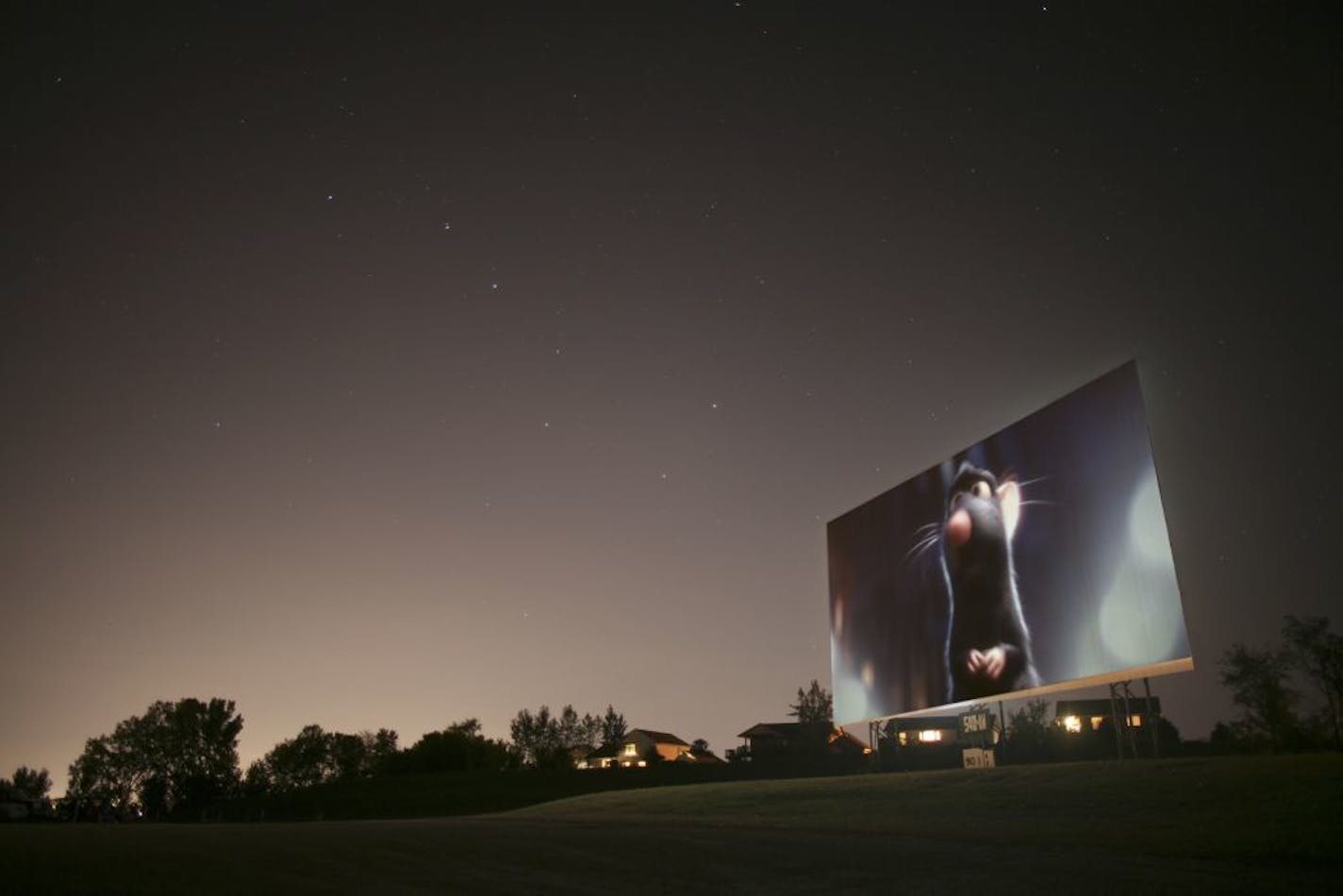 A view of the Cottage View screen last Friday night with a scene from Ratatouille, with the Big Dipper looming above the scene in this composite image. GENERAL INFORMATION: JEFF WHEELER � jwheeler@startribune.com COTTAGE GROVE - 9/14/07 - Another of the few remaining drive-in theaters in the metro area, the Cottage View in Cottage Grove, will likely close for good at the end of this season, to be replaced by a Wal-Mart.