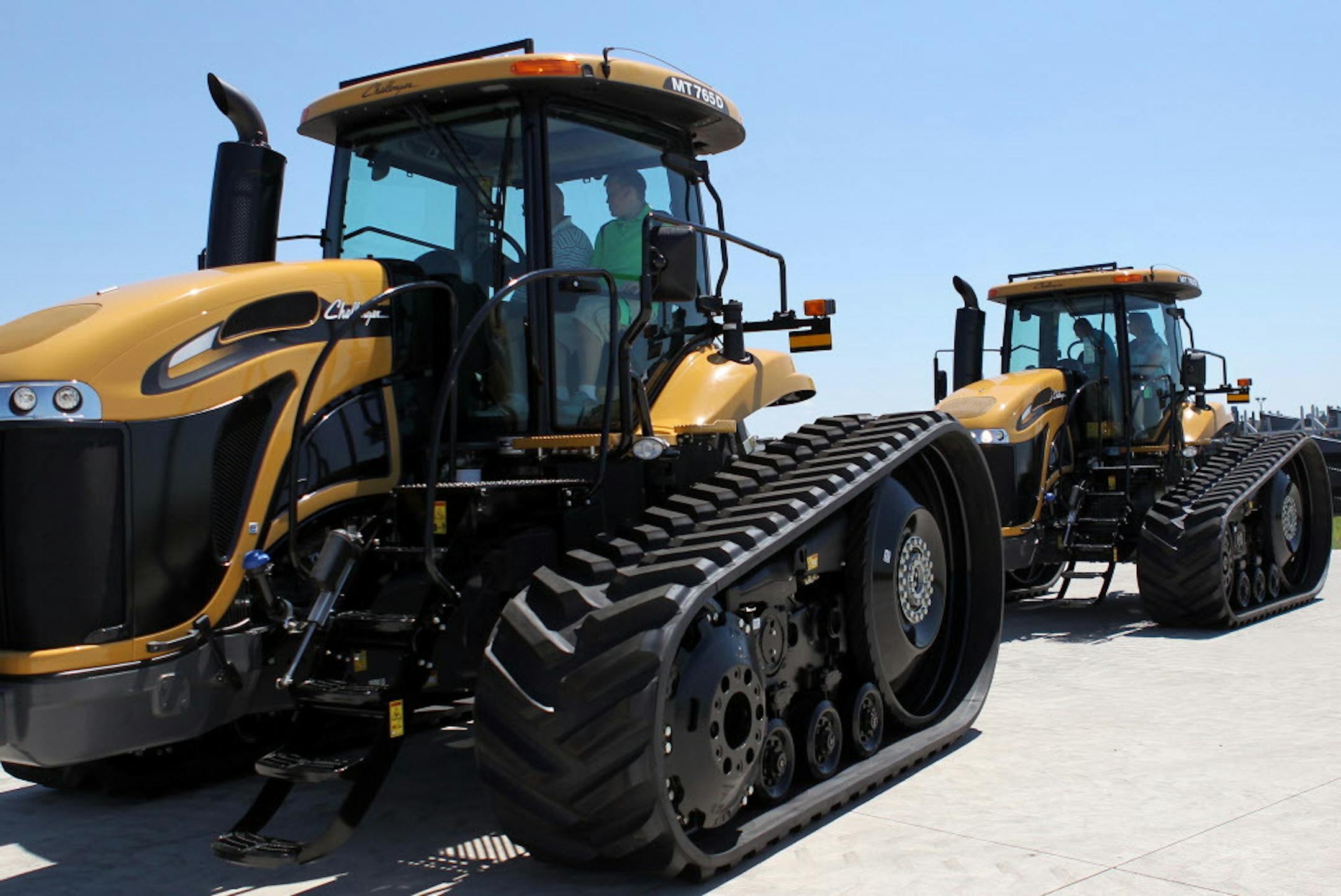 Eric Watson, of Renville, Minn., drives one of his two custom-built, right off the line tractors at the AGCO North American tractor production site in Jackson, Minn., on Thursday, July 18, 2013. AGCO has implemented an expansion project to add robotic welding equipment and more workers to grow production for increasing demand. ] (ANNA REED/STAR TRIBUNE) anna.reed@startribune.com (cq)