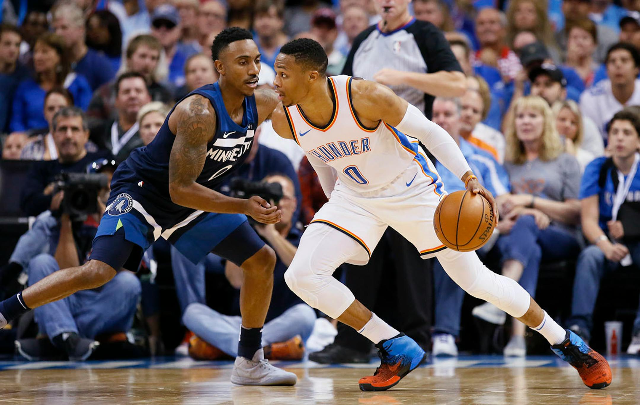 Oklahoma City Thunder guard Russell Westbrook (0) drives against Minnesota Timberwolves guard Jeff Teague (0) in thE second quarter of an NBA basketball game in Oklahoma City, Sunday, Oct. 22, 2017.