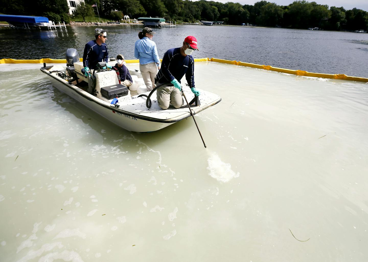 David Hillstrom treated an area on Christmas Lake for zebra mussels .Federal and state crews tested a product called Zequanox to try an control and infestation of zebra mussels on Christmas Lake Monday September 8 , 2014 in Shorewood, MN . A 50x60 feet section of the lake at the public access was treated . ] Jerry Holt Jerry.holt@startribune.com