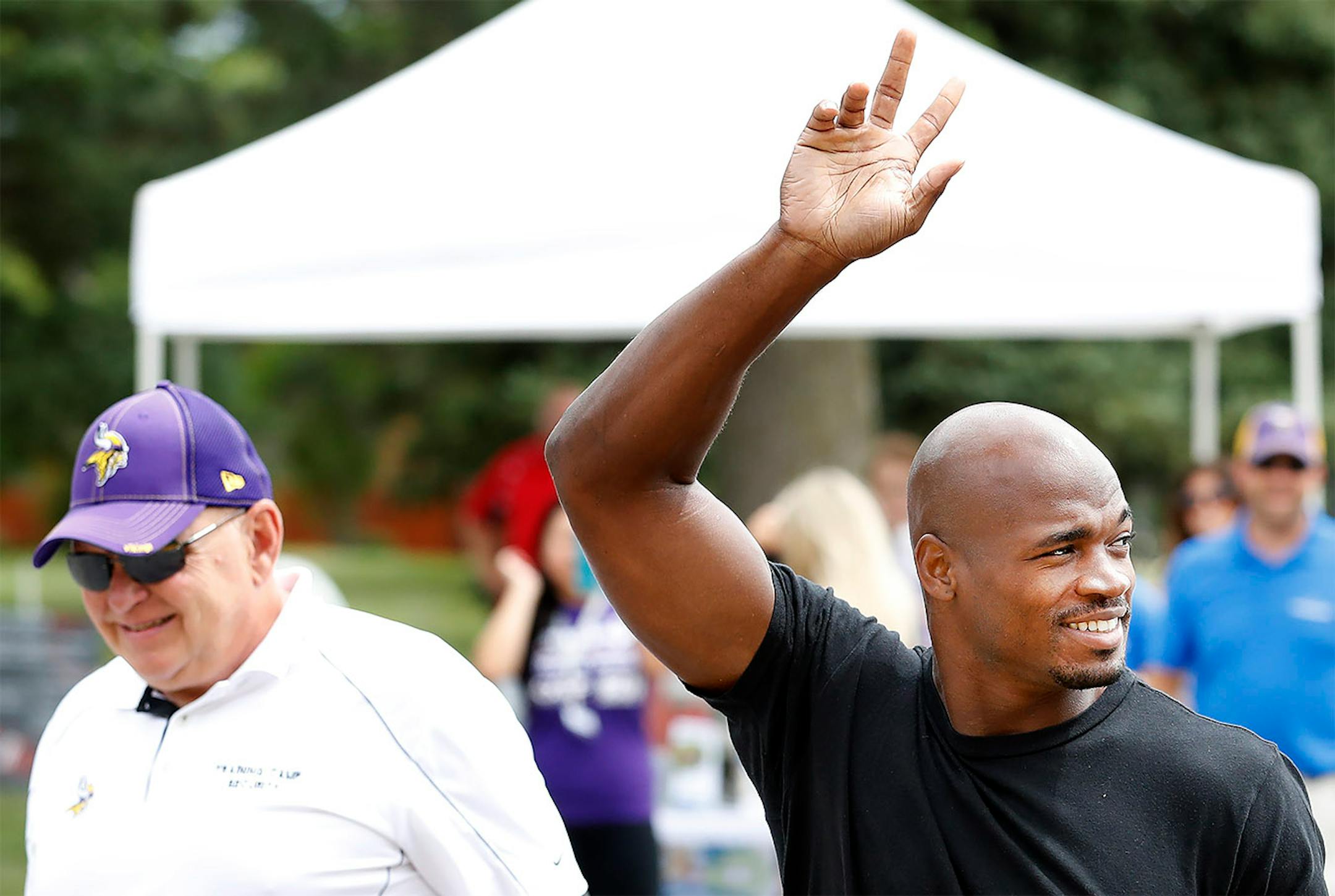 Minnesota Vikings running back Adrian Peterson waved to fans after arriving in Mankato.