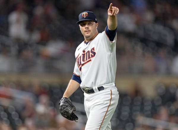 Minnesota Twins pitcher Caleb Thielbar (56) reacts after the final out of the top of the seventh inning Tuesday, August 16, 2022, at Target Field in M