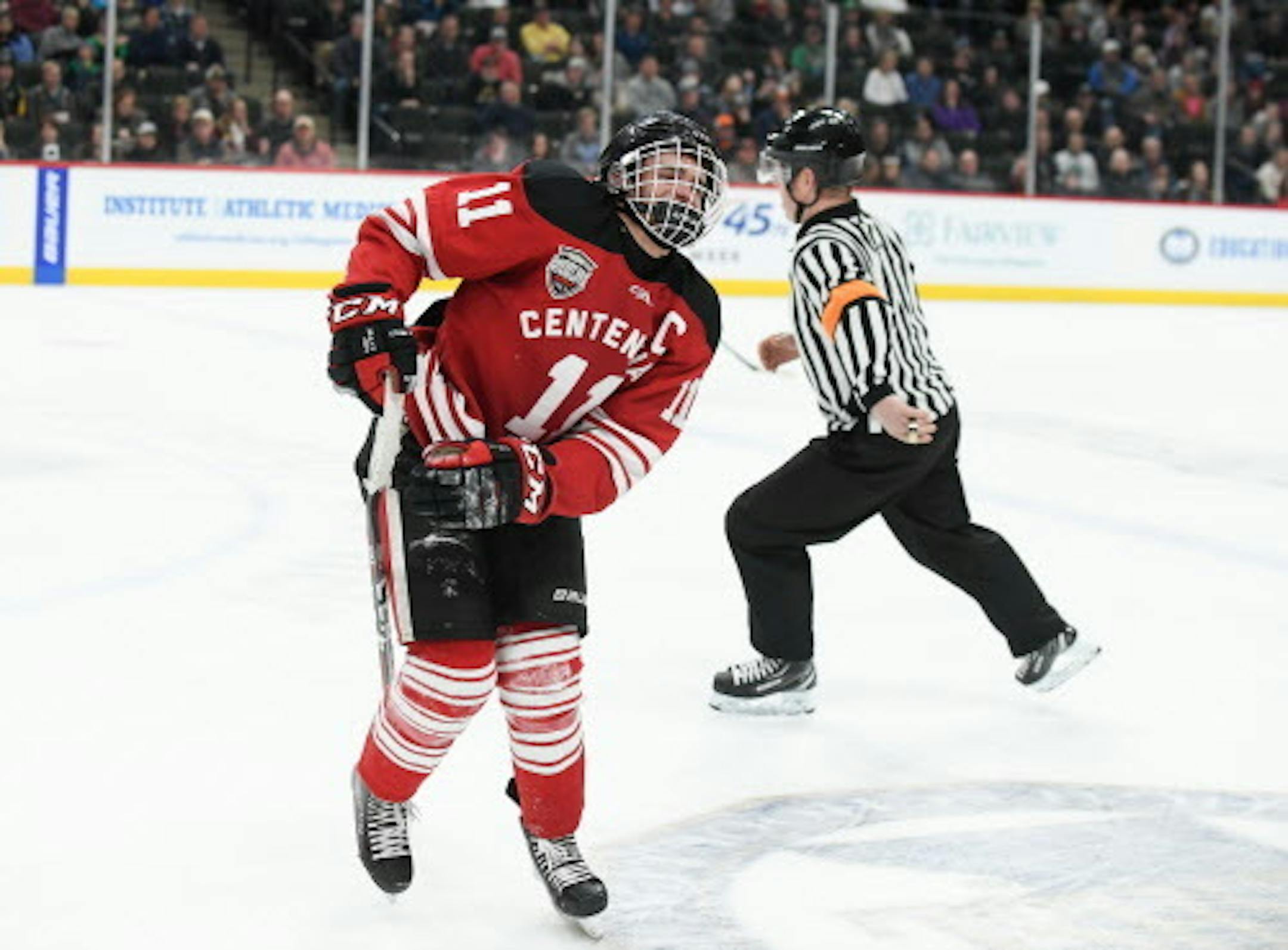 Centennial forward Lucas McGregor (11) hobbled off the ice with a lower body injury in the second period against Minnetonka.   ] AARON LAVINSKY ' aaron.lavinsky@startribune.com