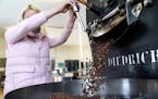 Paradise Coffee roast master Sam LeTendre pours freshly roasted, Ecuador-grown robusta, a breed of climate change-resistant coffee, into a cooling bin