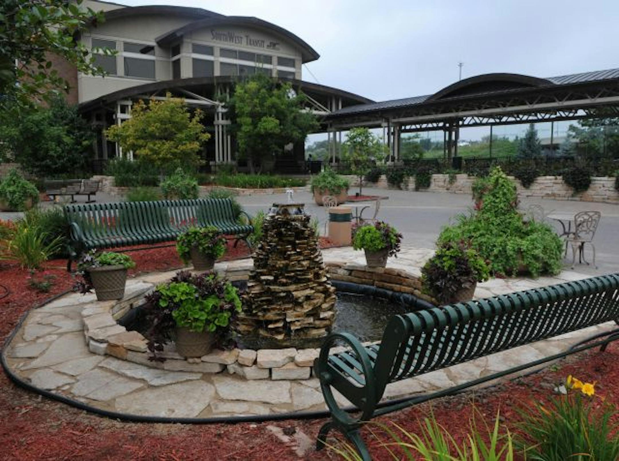 SouthWest Transit bus station features this fountain and landscaping that surround the station.