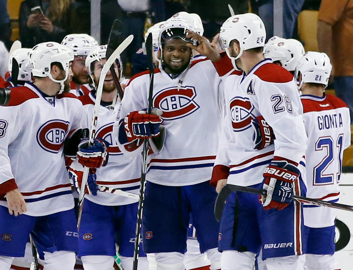 Montreal Canadiens defenseman P.K. Subban, middle, and his teammates celebrate after defeating the Boston Bruins 3-1 in Game 7 of an NHL hockey second-round playoff series in Boston, Wednesday, May 14, 2014. (AP Photo/Elise Amendola)