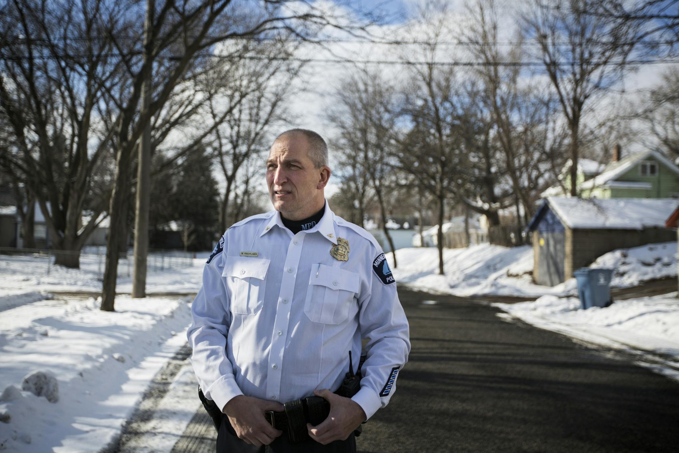 Inspector Mike Friestleben of Minneapolis Police Department's Fourth Precinct stands on the street near one of the houses where he lived growing up in north Minneapolis on Wednesday, January 27, 2016.