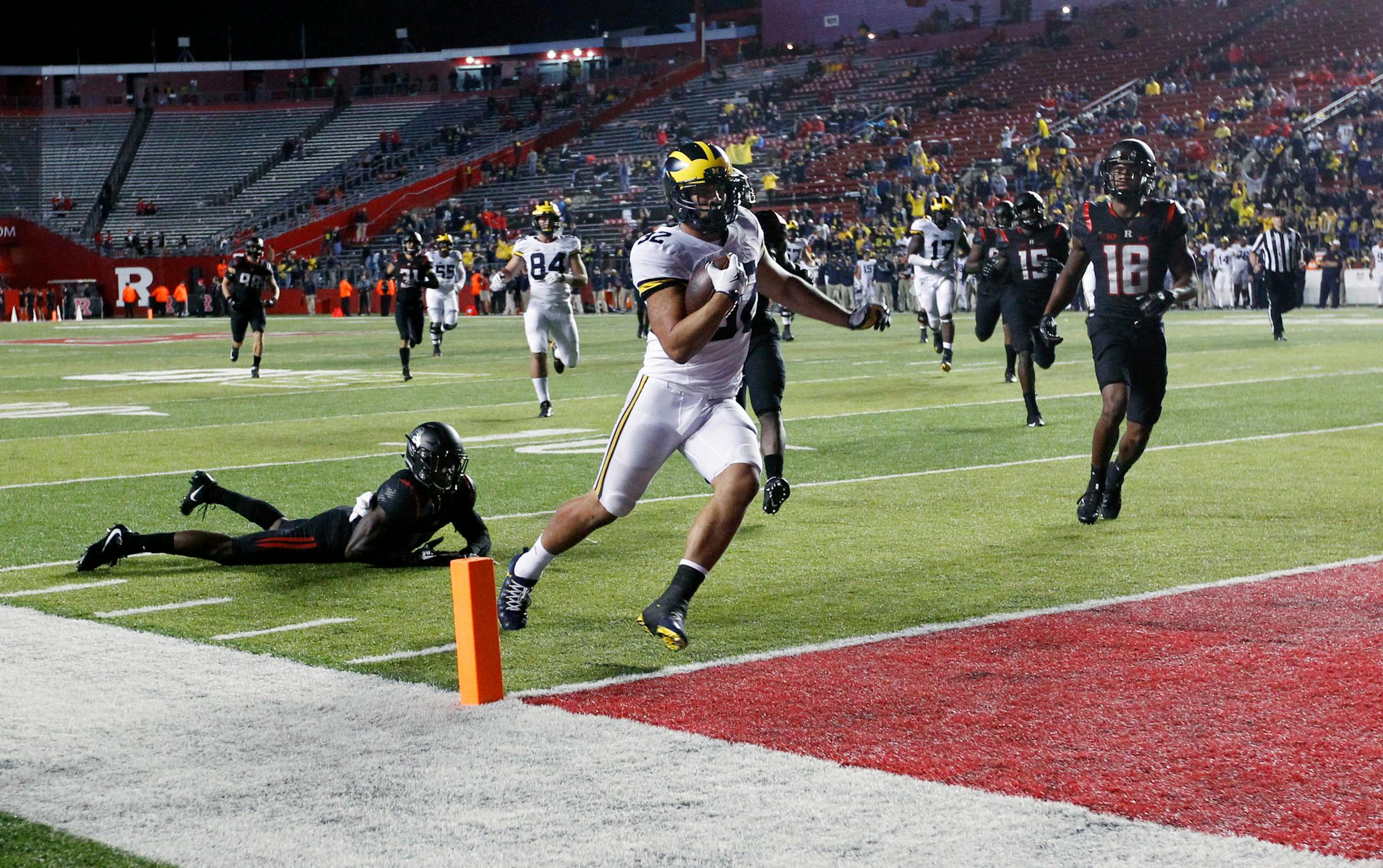 Michigan running back Ty Isaac (32) scores a touchdown during the second half of an NCAA college football game against Rutgers Saturday, Oct. 8, 2016, in Piscataway, N.J. (AP Photo/Mel Evans)
