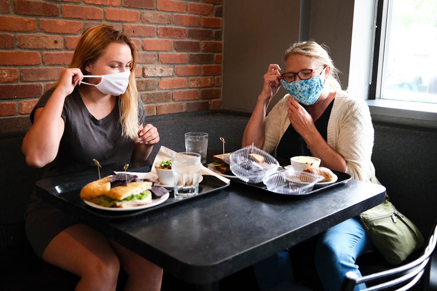 The mask mandate "just makes me feel more comfortable going out," said Katie Mrozek, a student at St. Kate's, with her mother, Sharon Mrozek, of Bloomington, at Cafe Latte in St. Paul on Wednesday afternoon.